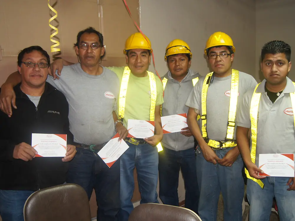 The employees received a diploma to commemorate the achievement.